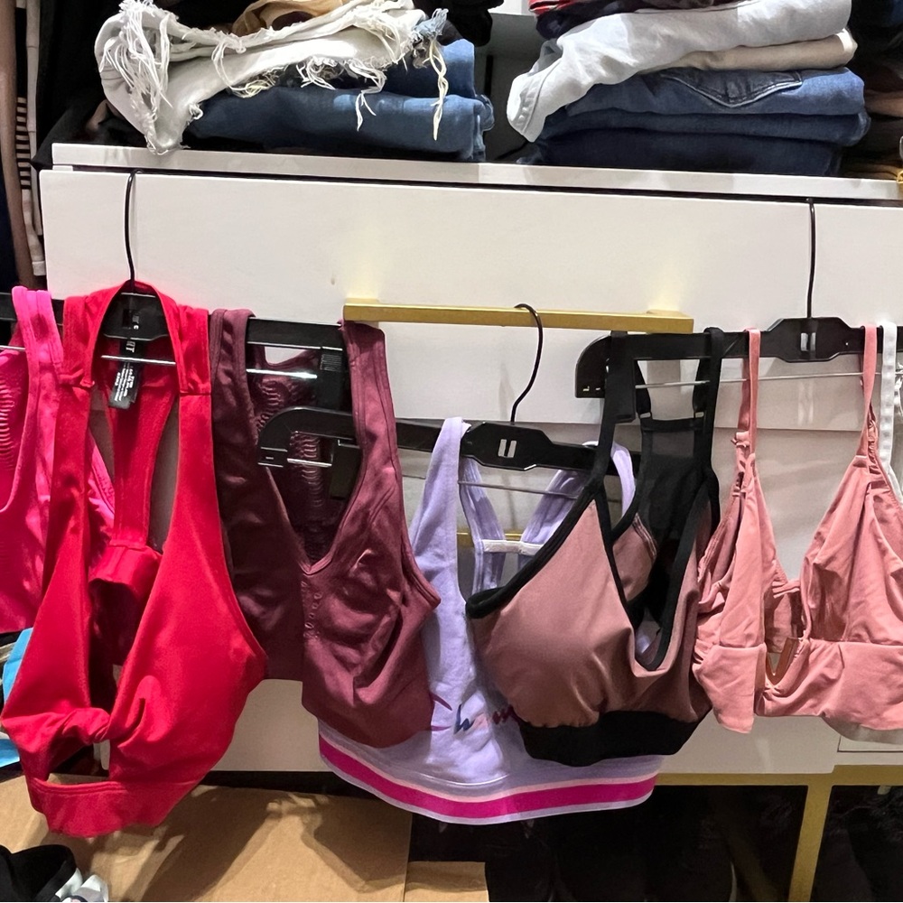 Various sports bra in pinks/red/purple/gray colors. Size small and medium